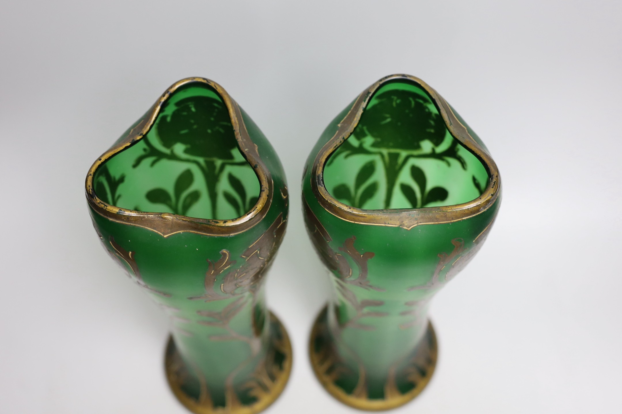 A pair of French green glass and gilt decorated Art Nouveau vases, 34cms high